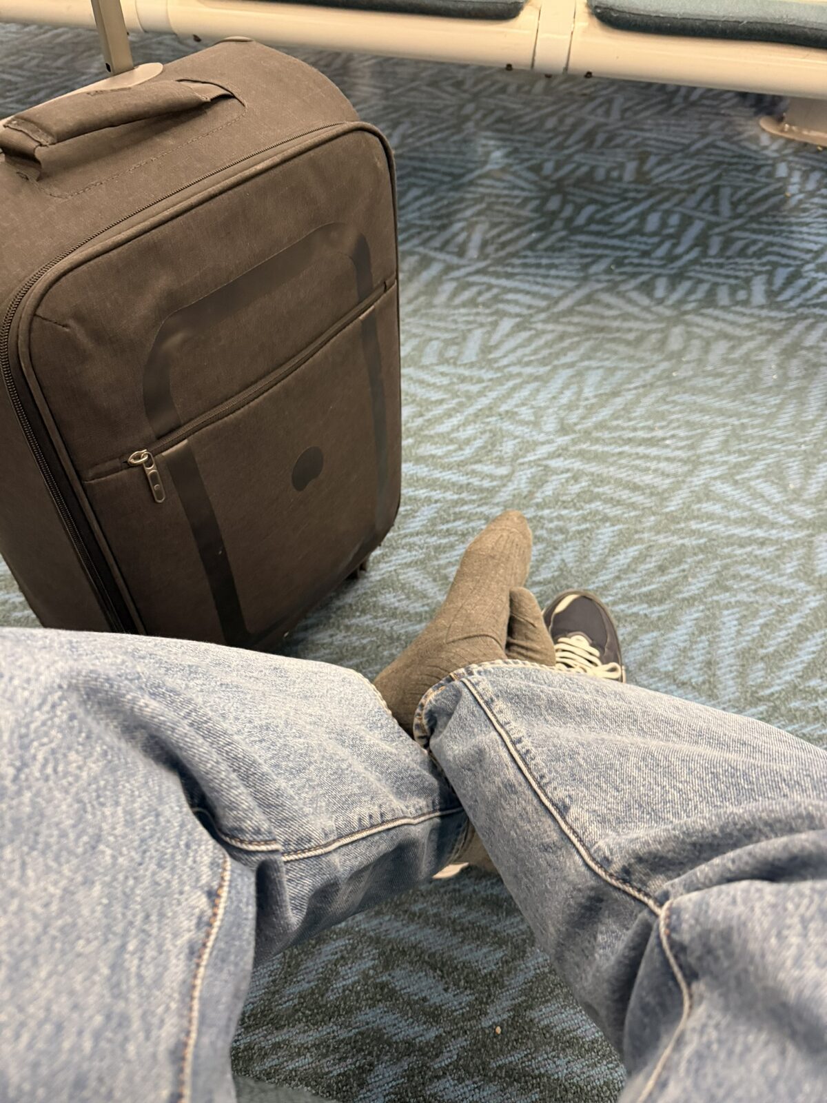 waiting to board the plane to New York