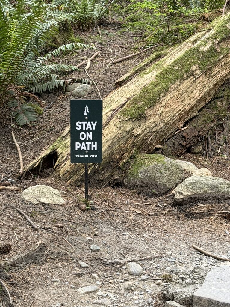 ‘stay on path’ sign at Capilano River park