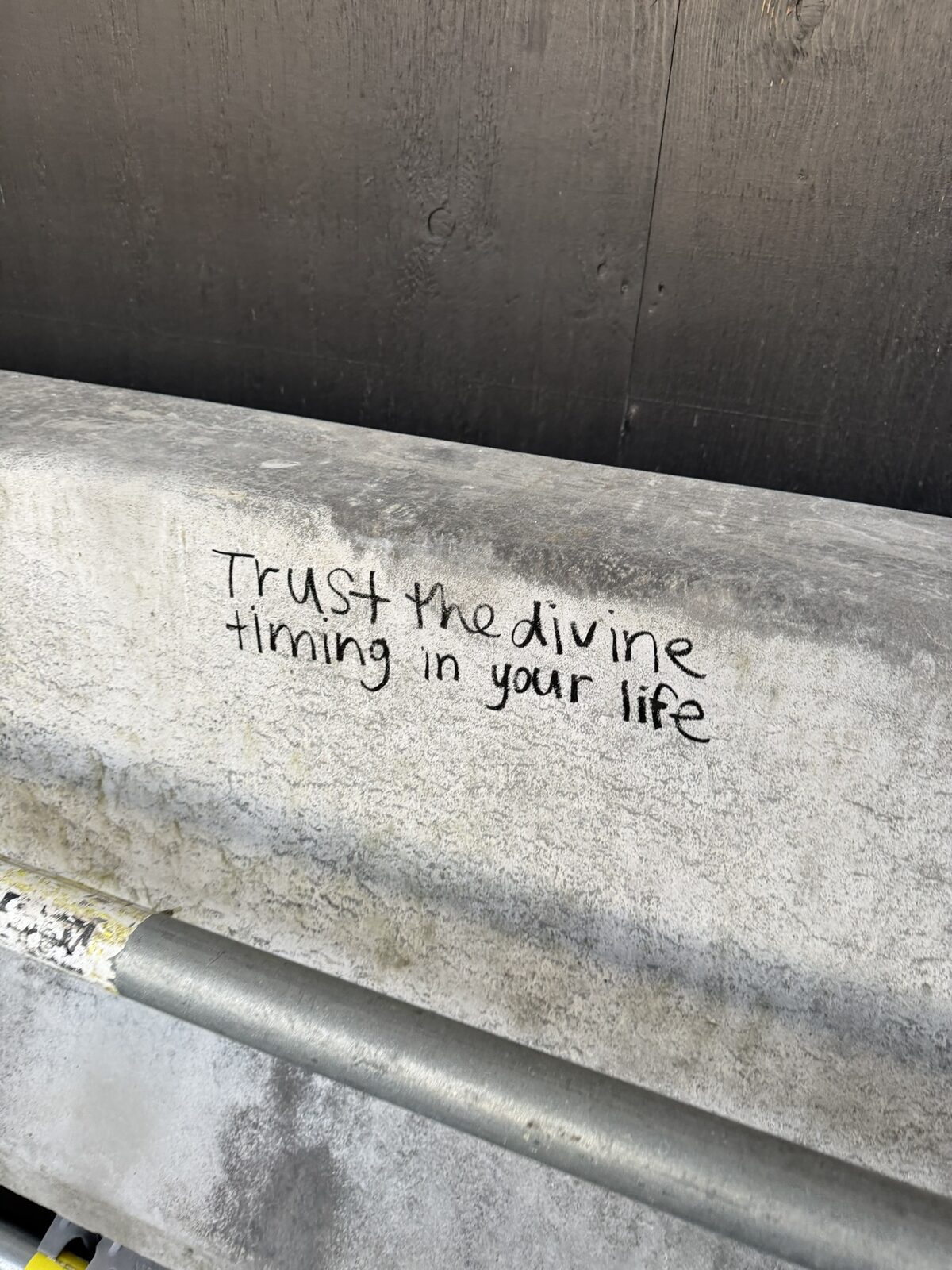 sign reading ‘trust the divine timing in your life’