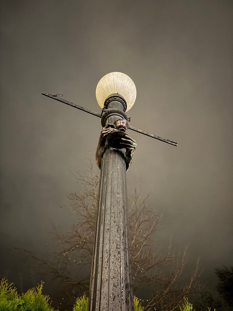 the lamp post with sculpture
