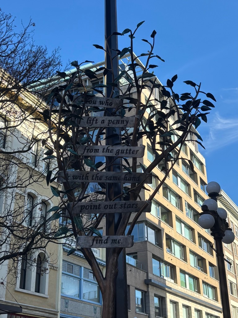from within fan tan alley showing leg and buddha at a corner
