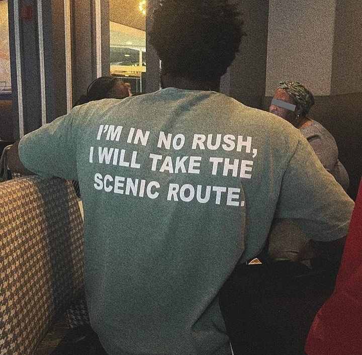 Person wearing a shirt that says 'I'm in no rush, I will take the scenic route'